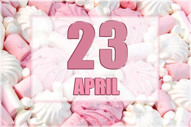 Calendar date on the background of white and pink marshmallows April 23 is the twentythird day of the month