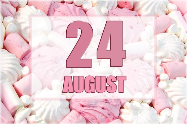 Calendar date on the background of white and pink marshmallows August 24 is the twentyfourth day of the month