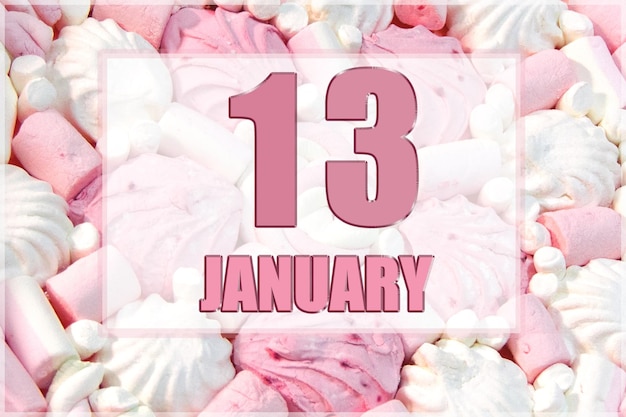 Calendar date on the background of white and pink marshmallows January 13 is the thirteenth day of the month