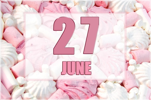 Calendar date on the background of white and pink marshmallows June 27 is the twentyseventh day of the month