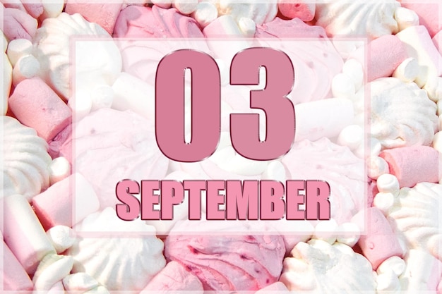 Calendar date on the background of white and pink marshmallows September 3 is the third day of the month