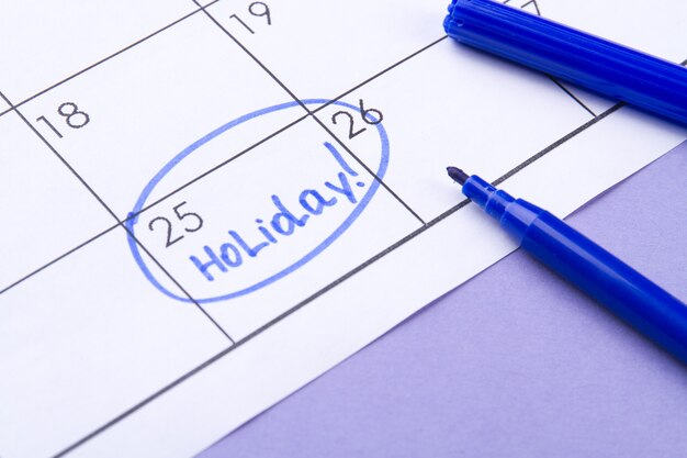 Calendar and holiday concept  day of the month marked as a holiday by a blue felttip pen