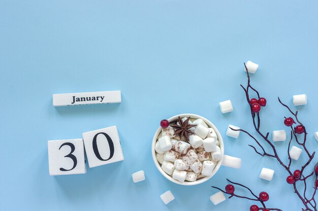 Calendar january 30 cup of cocoa, marshmallows and branch berries