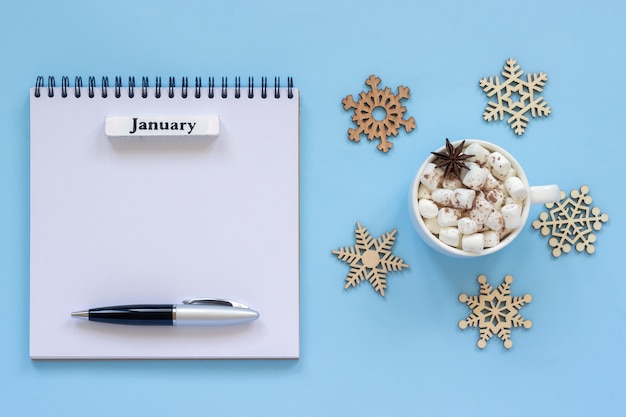 Calendar of January and cup of cocoa with marshmallow