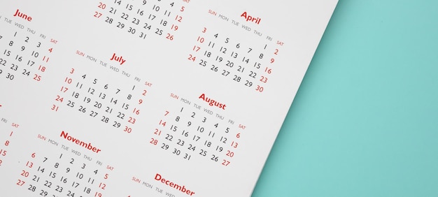 Calendar page on blue background business planning appointment meeting concept