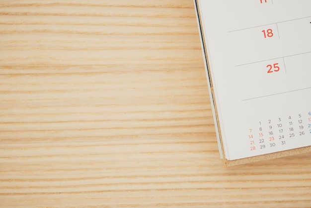 Calendar page on wood table background