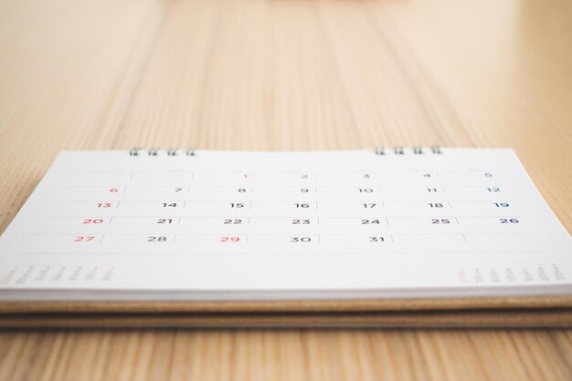 Calendar page on wood table background