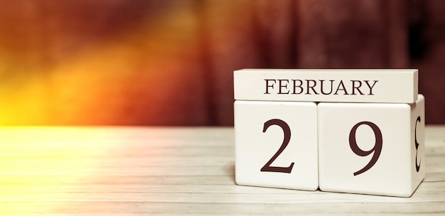 Calendar reminder event concept. Wooden cubes with numbers and month on February 29