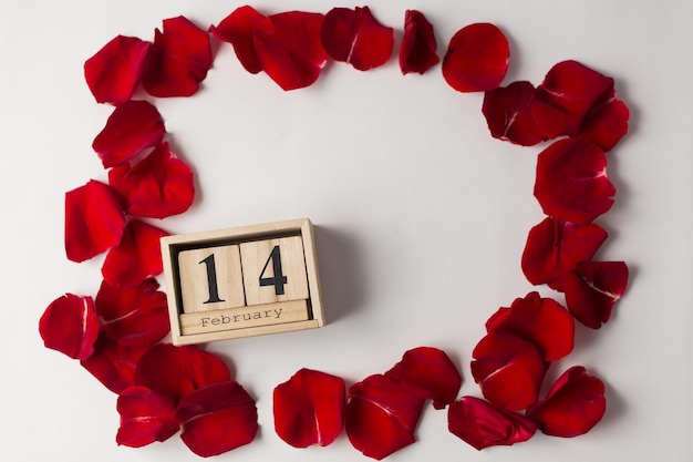 calendar with the date February 14 in a frame of red rose petals