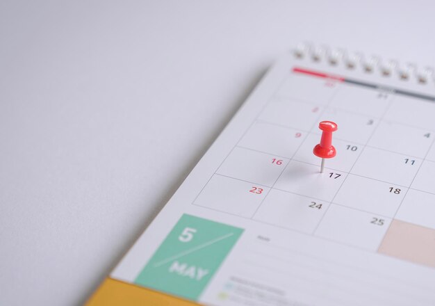 Calendar with red pin on May 17 Copy space