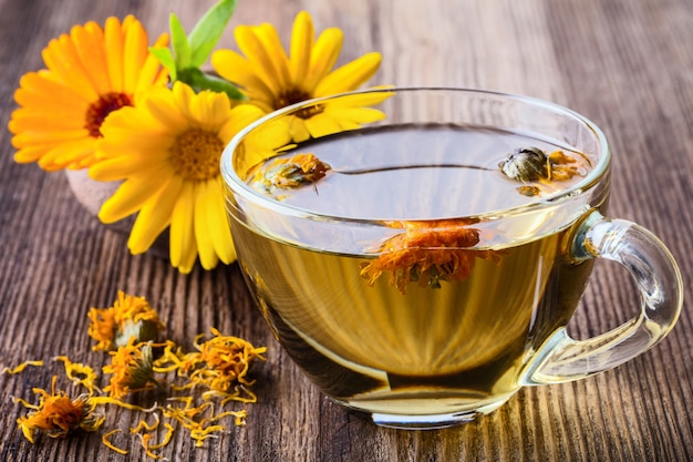 Calendula (Marigold) herbal tea in glass mug