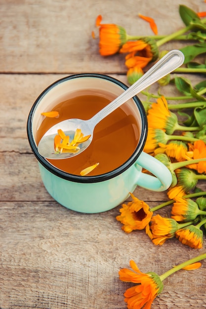 Calendula tea and flowers. Selective focus. nature.