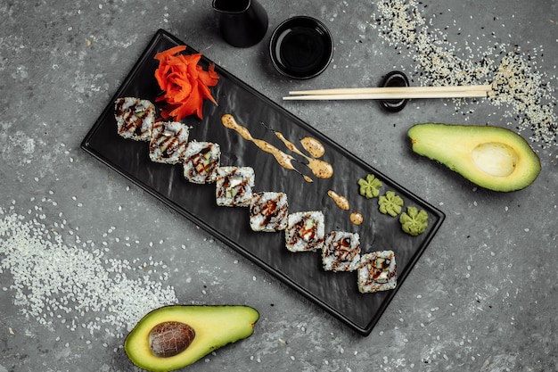 California roll sushi with smoked eel, cucumber, avocado. sushi\
menu. japanese food.