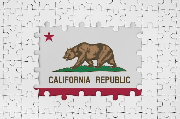 California us state flag in frame of white puzzle pieces with missing central part