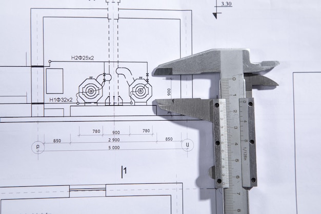 Caliper on engineering drawing blueprint