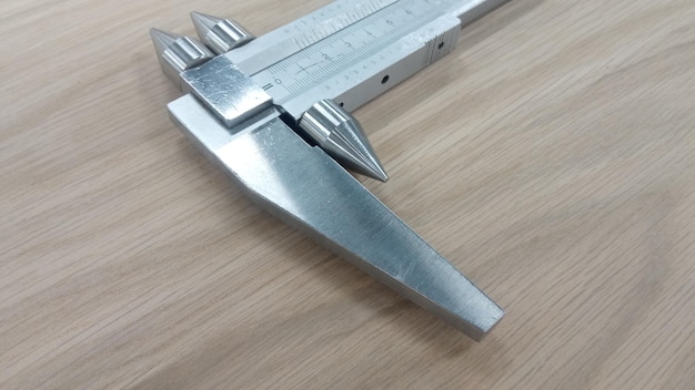 Photo caliper to measure the distance between the holes