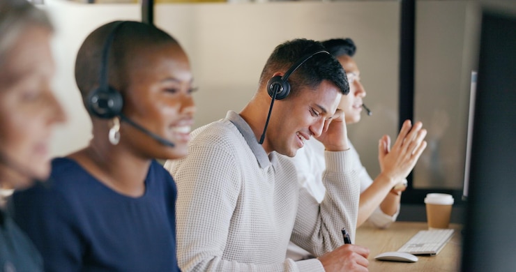Photo call center business man and team communication global office and telemarketing diversity telecom technical support or virtual help desk agent consultant or ecommerce worker smile on computer