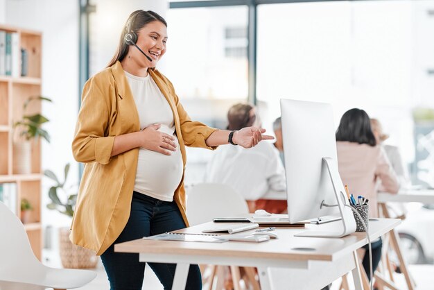 Call center conversation and pregnant woman in telemarketing support on a computer Contact us consulting and customer service employee talking for digital help advice and work during pregnancy