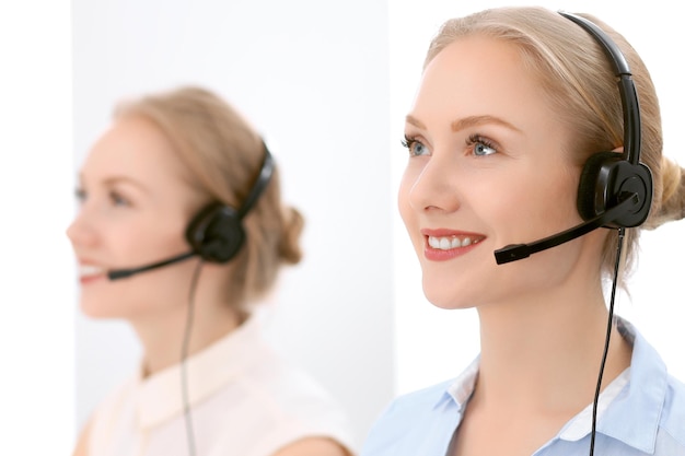 Call center Focus on beautiful blonde woman in headset