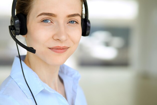 Call center operator Portrait of beautiful business woman in headset