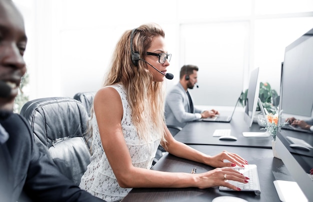 Call center staff at the Desk in the business center photo with copy space