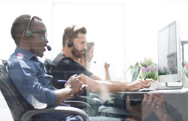 Call center staff sitting at the desk