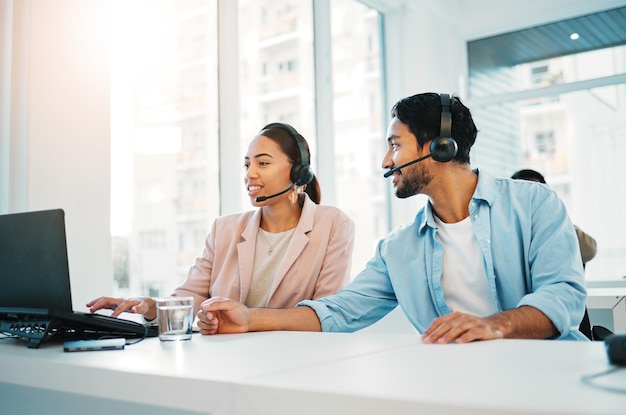Call center training with manager and support laptop and help with CRM process customer service and telecom Working together team and coaching with people in office telemarketing and advice