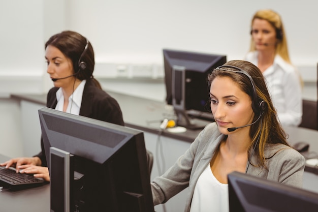 Call centre agents talking on the headset