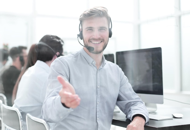 Call operator stretching out his hand for a handshake