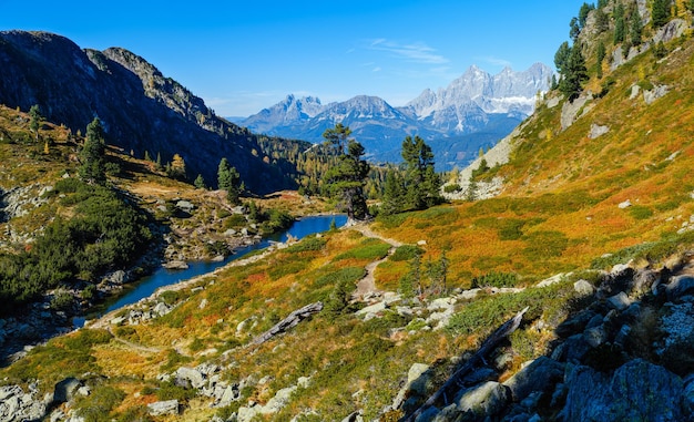 Calm autumn Alps mountain lake with clear transparent water and reflections Spiegelsee or Mirror Lake Reiteralm Steiermark Austria