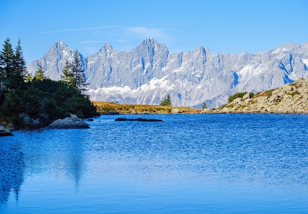 Calm autumn Alps mountain lake with clear transparent water and reflections Spiegelsee or Mirror Lake Reiteralm Steiermark Austria