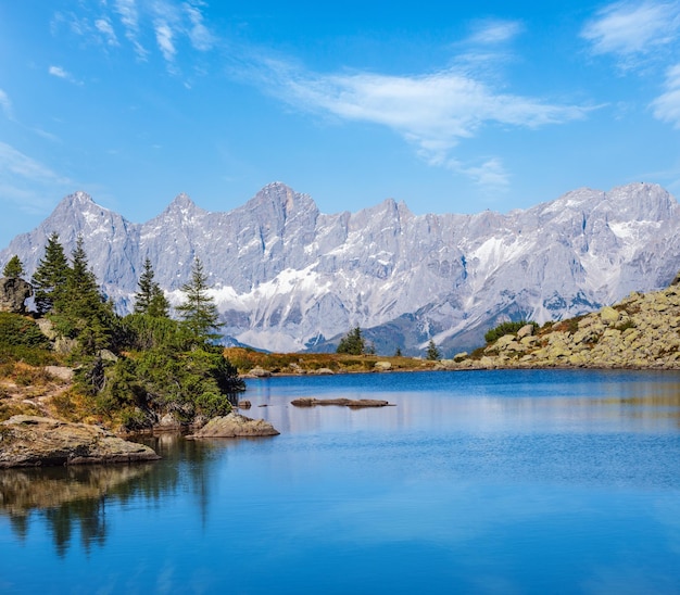 Calm autumn Alps mountain lake with clear transparent water and reflections Spiegelsee or Mittersee or Mirror Lake Reiteralm Steiermark Austria