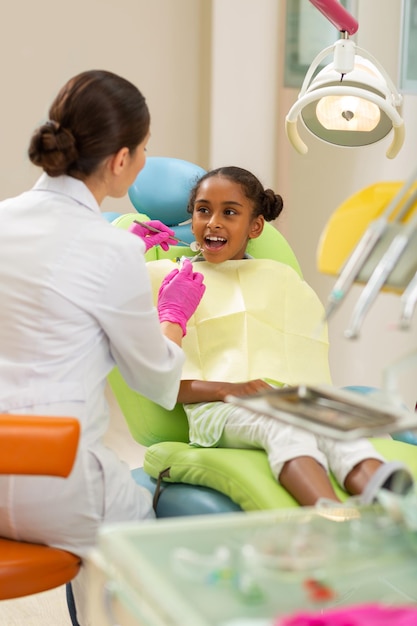 Calm female patient sitting at the dentists