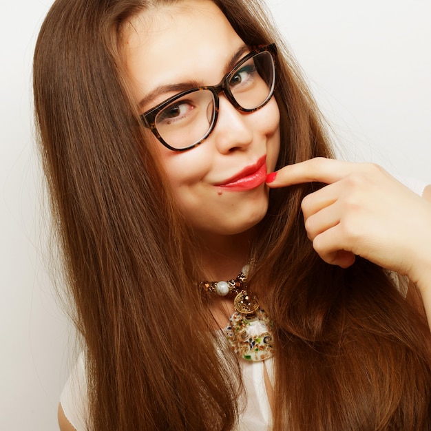 Calm and friendly young woman with glasses