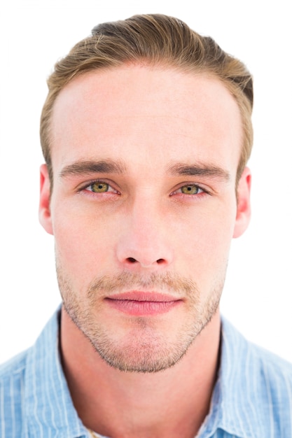 Calm man in shirt looking at camera