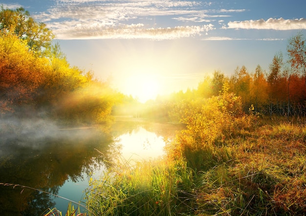 Calm river in autumn at the sunrise