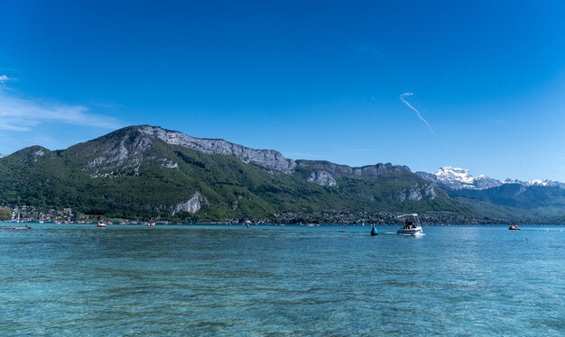 Calm sea with mountain range in background