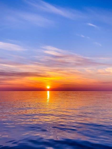 Calm sea with sunset sky In Sochi