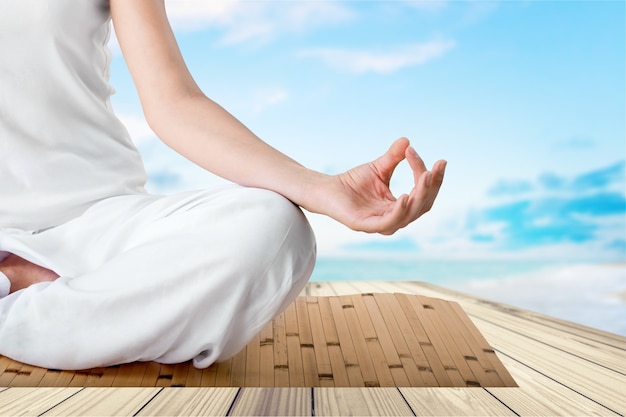 Calm woman doing yoga exercise. isolated on  background