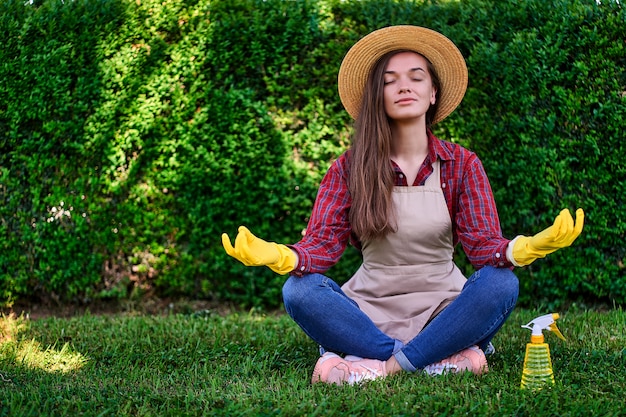 Calm woman gardener meditating