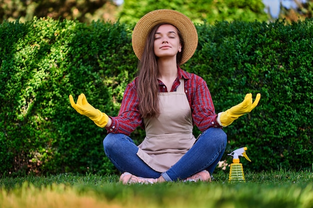 Calm woman gardener meditating