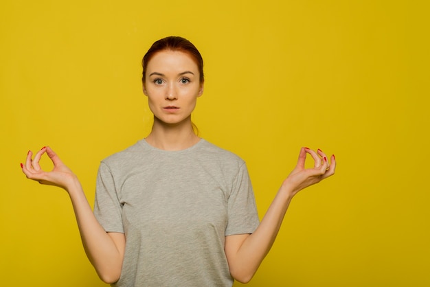 Calm woman relaxing meditating, no stress free relief at work concept, mindful peaceful young businesswoman or student practicing breathing yoga exercise