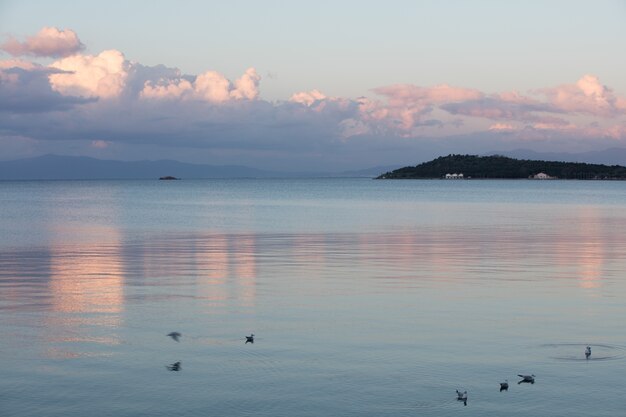 Calmed sea and cloudy sky