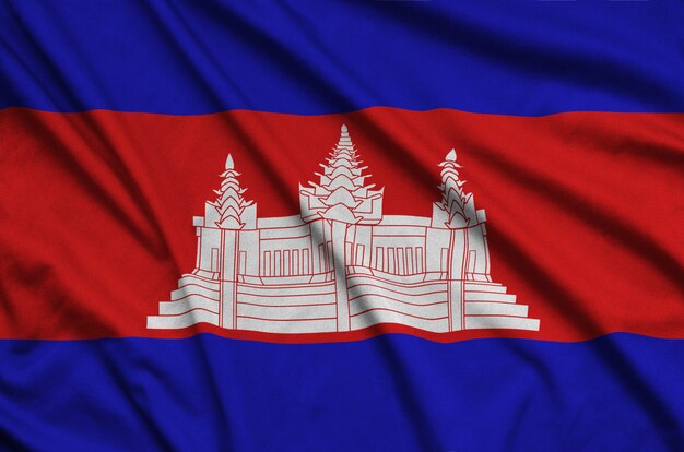 Cambodia flag is depicted on a sports cloth fabric with many folds.