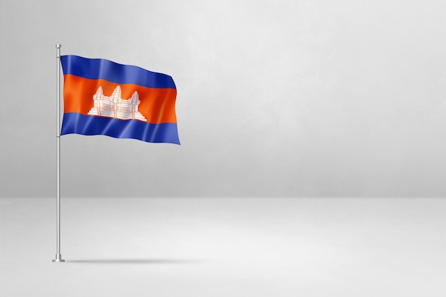 白いコンクリート壁の背景に分離されたカンボジアの旗