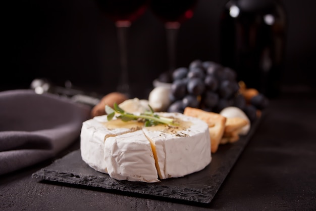 Camembert brie on black board