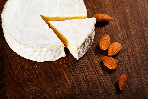 Camembert cheese or brie on wood