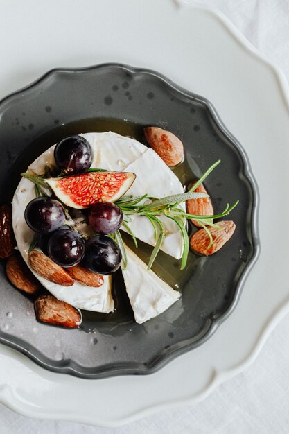 Camembert cheese with fresh purple figs
