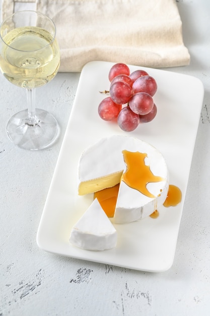 Camembert cheese with glass of wine