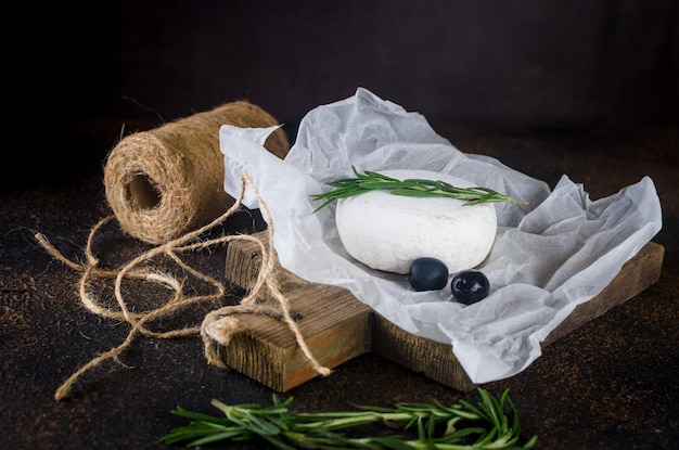 Camembert cheese with white mold walnuts honey and dried fruits Dinner or aperitif concept